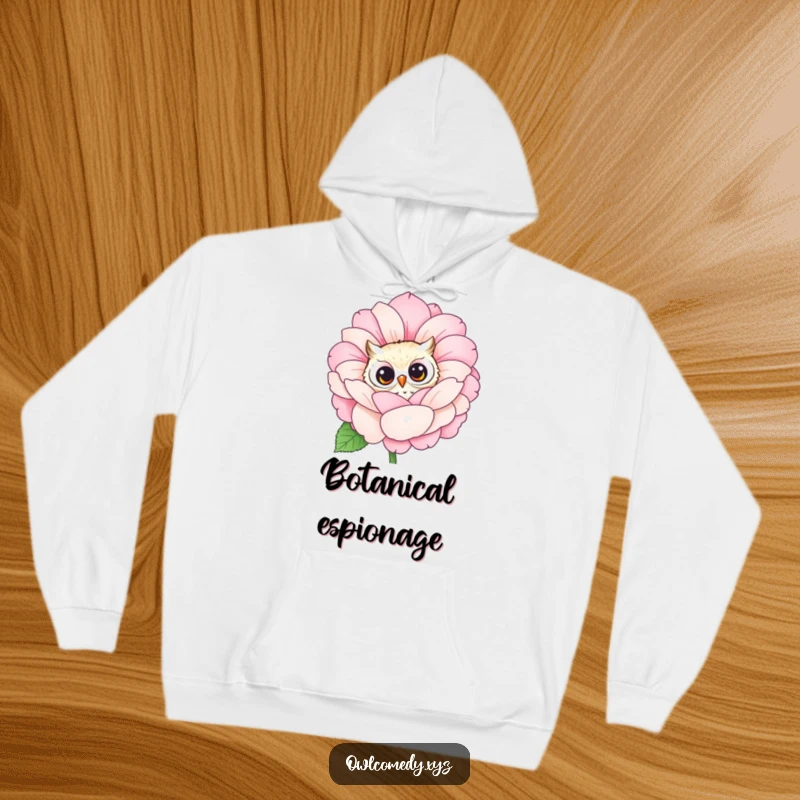 Comfortable hoodie featuring a funny owl peeking curiously from behind a large, blooming flower. Perfect for nature lovers.