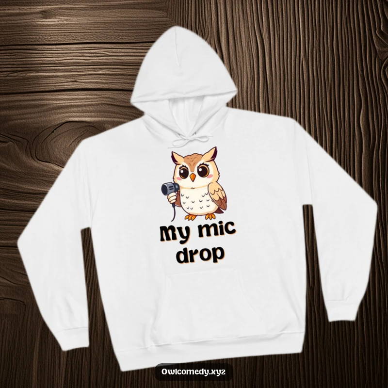 Funny hoodie featuring a smiling owl holding a microphone, offering warmth and humor for the performer at heart.