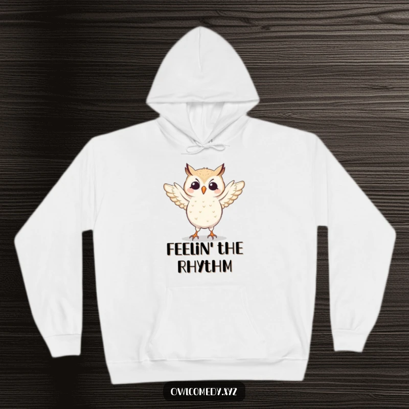 Comfortable hoodie featuring a funny owl caught in a silly dance, wings flapping with joy. Perfect for active or relaxed days.