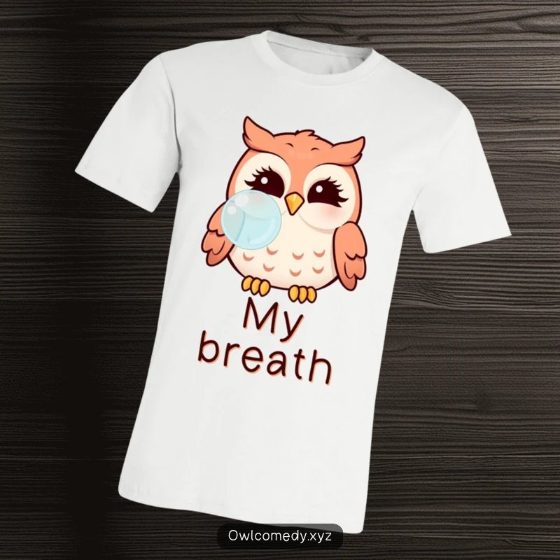 Funny Kawaii owl with puffed cheeks blowing a bubble on a t-shirt, a whimsical and cute graphic.