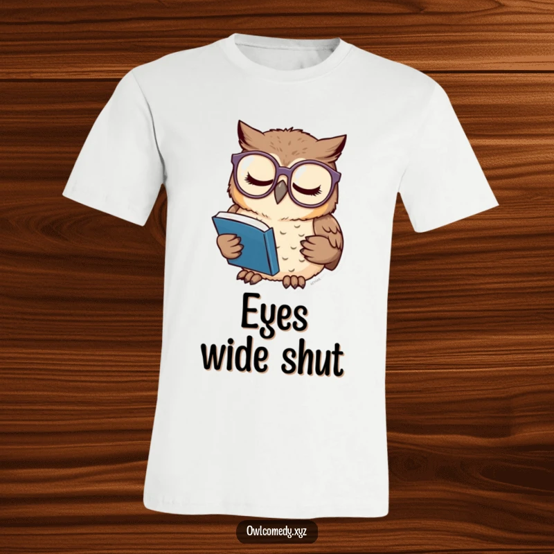 Funny t-shirt depicting a sleepy owl wearing oversized glasses, engrossed in reading a miniature book with dedication.
